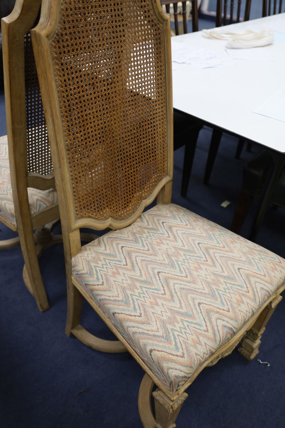 A set of four caned high back dining chairs